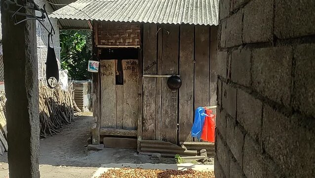 A Vidio of Traditional Indonesian wooden house with bamboo fence rustic vintage look.Lombok,NTB,Indonesia.2-october-2026