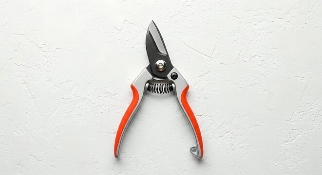 Pruning shears with orange handles isolated.