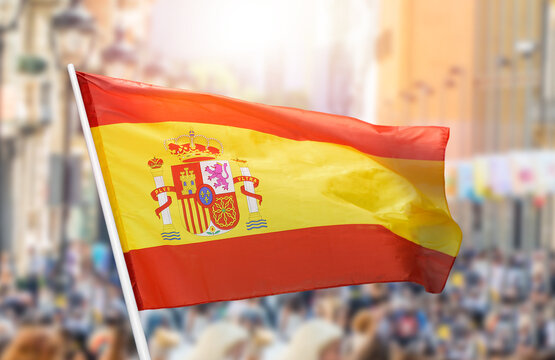 Shot of the Spanish flag blowing in the wind at street