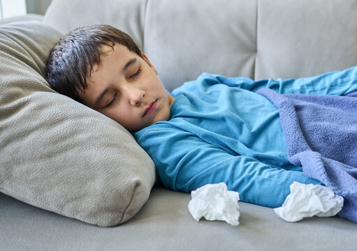 Shot of a child recovering from an illness in couch at home