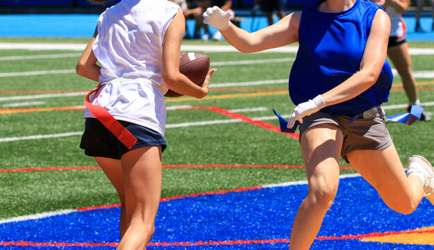 Youth Players Engaging in Girls Flag Football Game