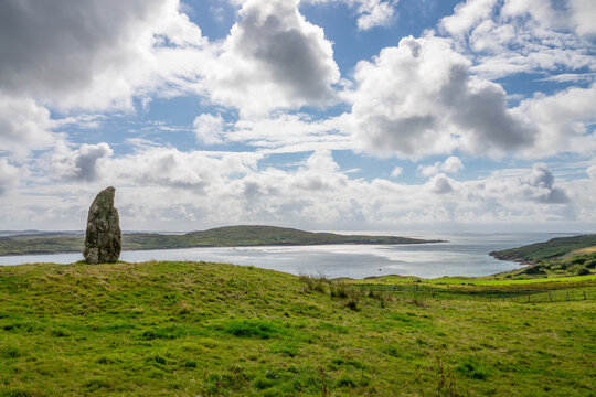 Standing stone near Clifden castle, Connemara coastal landscape, County Galway, Ireland