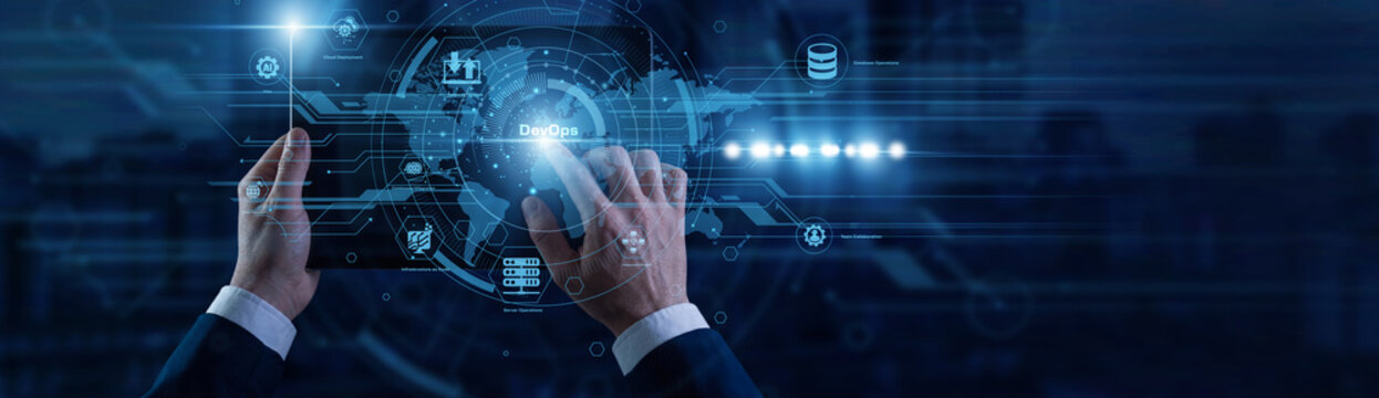 Systems engineer touching the tablet monitoring continuous integration and automated code deployments on virtual screen connected to global network. Agile DevOps operations platform.