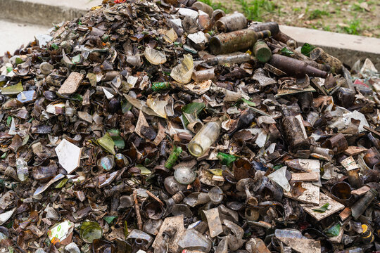 View of a large pile of discarded broken glass bottles and sharp shards in Wewak, East Sepik Province, Papua New Guinea.