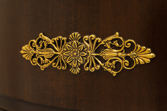 Golden furniture ornament close up