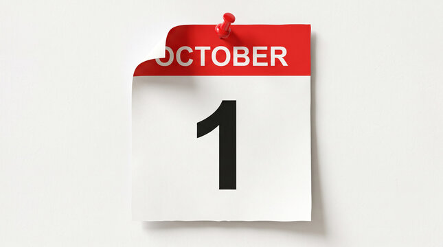 Calendar page showing the first day of october pinned to a wall, isolated on white background