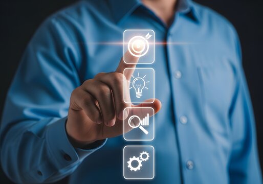 Businessman pointing finger at futuristic virtual menu icons with target and strategy symbols