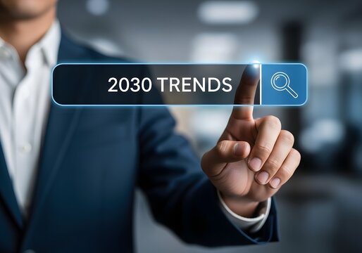 Businessman pointing finger at virtual search bar displaying 2030 trends in modern office background
