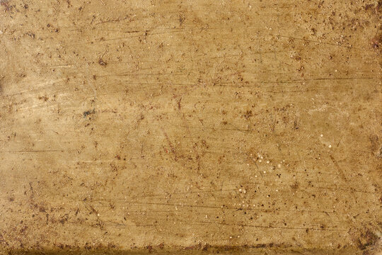 old scratched metal surface texture, rusty brown and golden brass material with grunge pattern in close-up view, industrial design backdrop