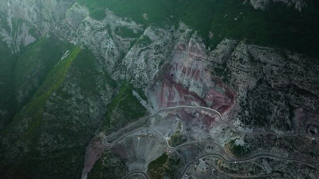 Descending Aerial View of Switchback Roads in Temal Albania