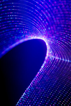 3D luminous particle tunnel background with radial blue and pink data lines