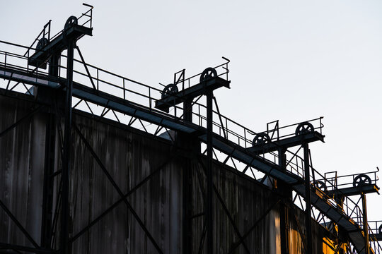 View of the industrial steel structure with pulleys and metal beams at the historic site in Ostrava, Moravian-Silesian Reg, Czechia.