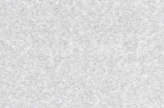 Coarse paper grain with dark embedded fibers running through a white sheet, a fibrous texture for book covers and digital collage layers with a pronounced irregular surface