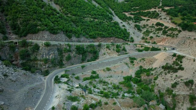 Aerial View of Mountain Road Switchbacks in Kelmend Albania