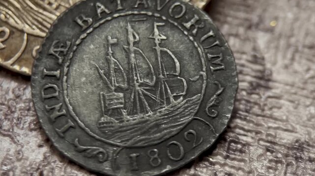 The front side of an antique Batavorum gulden coin, highlighting a sailing ship design, aged surface, worn texture, and distinctive historical numismatic character for collection use.