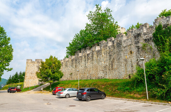 Celje Castle stone walls and parking area under cloudy sky, Celje, Slovenia, 22 June 2019