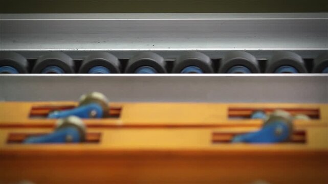 Industrial Conveyor Roller System Moving in Warehouse Environment, Close Up 