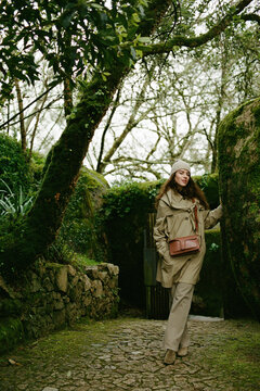Woman Exploring a Mossy Garden in Sintra