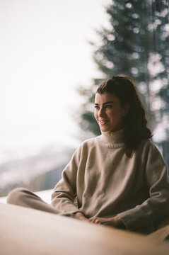 Relaxed Woman at a Winter Mountain Retreat