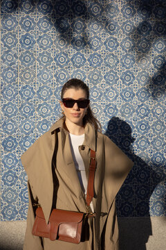 Portrait of woman against Portuguese tile wall