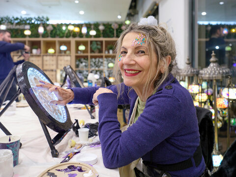 Retired Woman Enjoys an Art Class