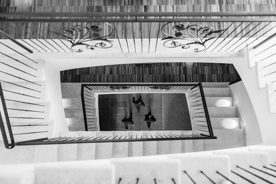 Spiral Staircase With People Viewed From Above