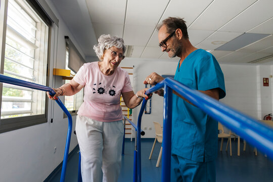 Elderly woman receiving physical therapy with healthcare professional