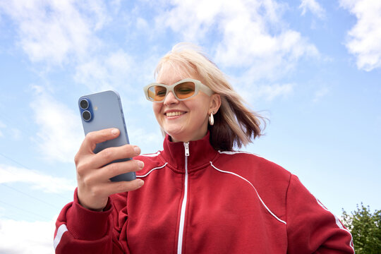 Woman Using Smartphone Outdoors, Wide Angle Low Angle Direct Flash
