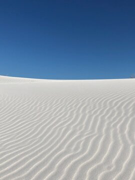 Rippled white sand dunes against a cloudless blue sky, Pringle Bay, Western Cape, South Africa