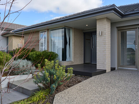House Entrance With Plants and Pathway