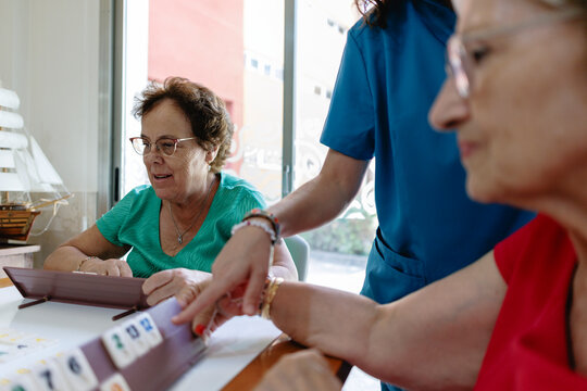 Elderly Care Home Staff and Patients in Rehabilitation and Swimming Po