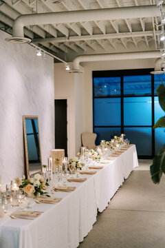 Elegant wedding reception table with floral arrangements