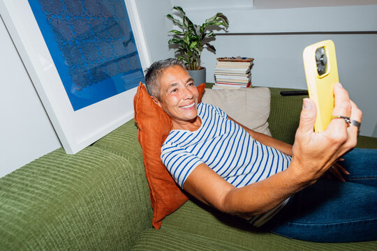 Video call on sofa at home