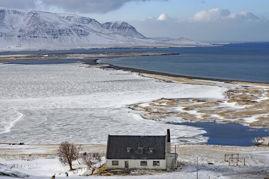Abandoned house in front of wide bay, wintry landscape, Skagafj&ouml;r&eth;ur, Nor&eth;urland vestra, Iceland