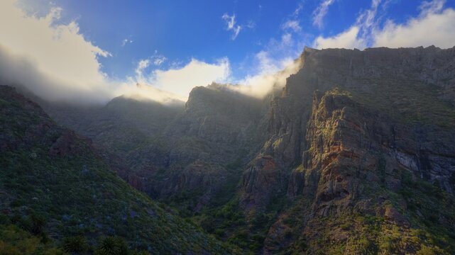 Dramatic light hits the steep cliffs and gives them a vivid color, Masca, Barranco de Masca, Gorge, Teno, Teno Mountains, Northwest Tenerife, Tenerife, Canary Islands, Spain
