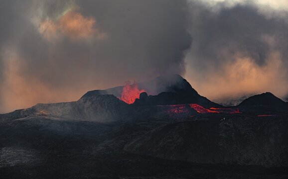Erupting volcano with lava fountains and lava field, crater with erupting lava and lava flow, Fagradalsfjall, Kr&yacute;suv&iacute;k volcano system, Reykjanes Peninsula, Iceland