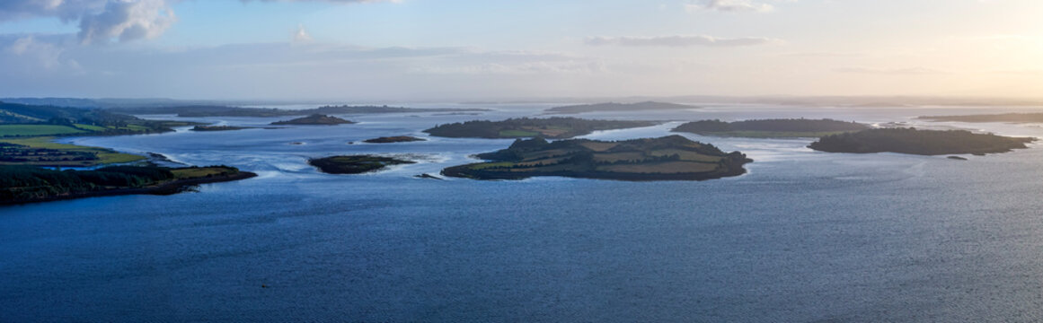 Aerial view of Clew Bay drumlin islands in County Mayo Ireland. Coastal archipelago with small islands, green fields and blue waters in Ireland. Unique geological formations along Wild Atlantic Way.