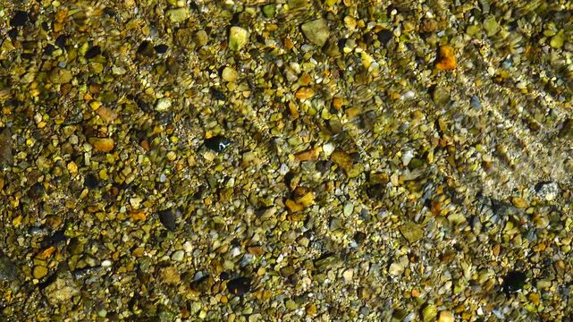 crystal water on fresh stream at vintage village in Shirakawago, Japan.