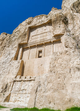 Facade of the tomb of Darius the Great carved into the stone cliff face at the Naqsh-e Rostam necropolis near Persepolis, Fars Province, Iran