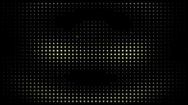 Abstract yellow glowing digital dots pattern on black background