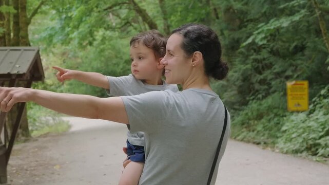 Curious Mother and Son Pointing Out Sights in Nature at Othello Tunnels, Hope, British Columbia
