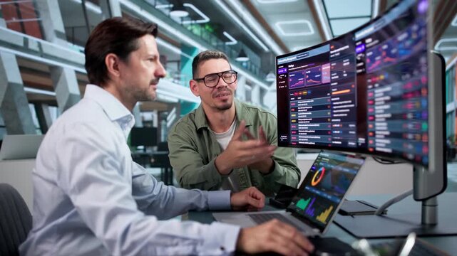 IT Manager And Colleague Reviewing Cybersecurity Risk Assessment Findings