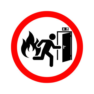 Circular red and white safety sign featuring a black silhouette of a person running away from flames toward an open emergency exit door with an overhead exit sign