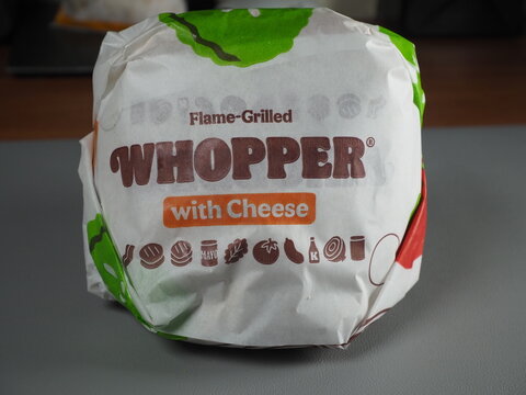 Burger King Whopper With Cheese Wrapped In Branded Paper Wrapper Photo