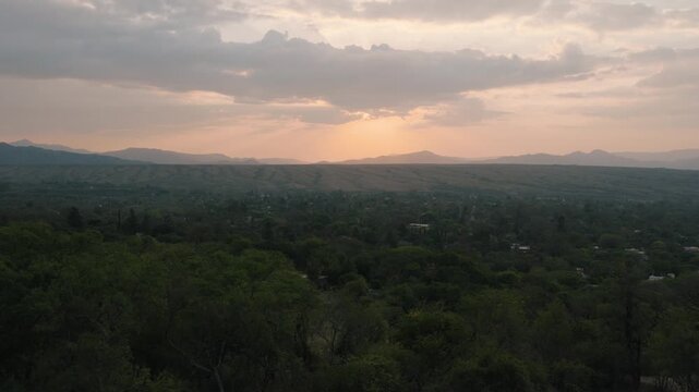 Serene twilight glow over a sprawling forested valley