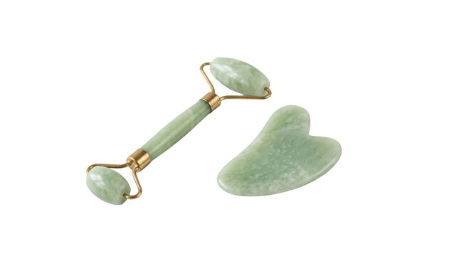 Jade roller and gua sha tool on transparent background