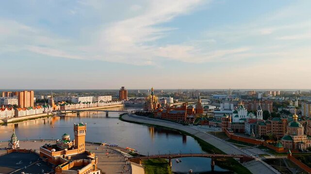 Yoshkar-Ola, Russia. City center during sunset. Embankment of the river Malaya Kokshaga. Drone footage