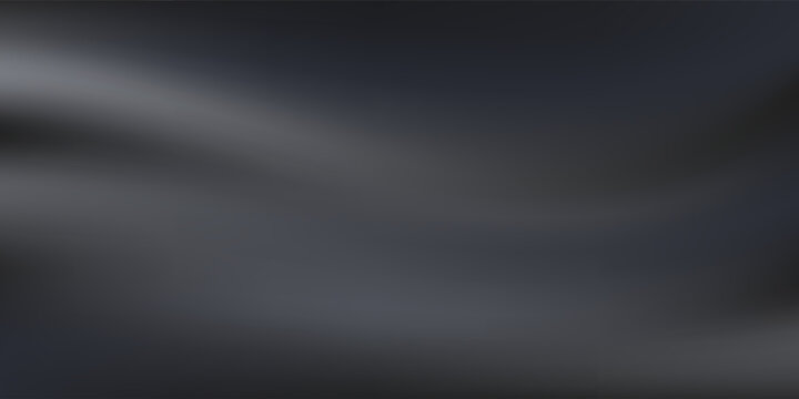 Grainy textured surface backlit, casting dramatic shadowy gradient across darkened plane