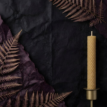 Moody gothic flat lay with natural beeswax candle, dark fern leaf frame
