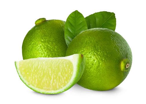 Fresh limes and green leaves isolated on white. Whole and sliced